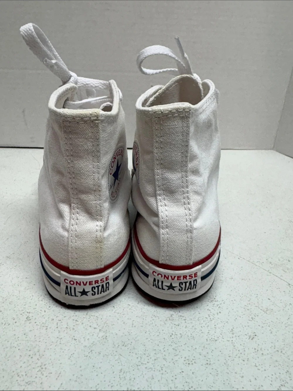 Converse White High Top Sneakers with Red and Blue Stripes